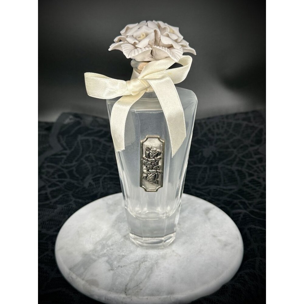 vintage Cellini Collection perfume bottle with a porcelain rose stopper.